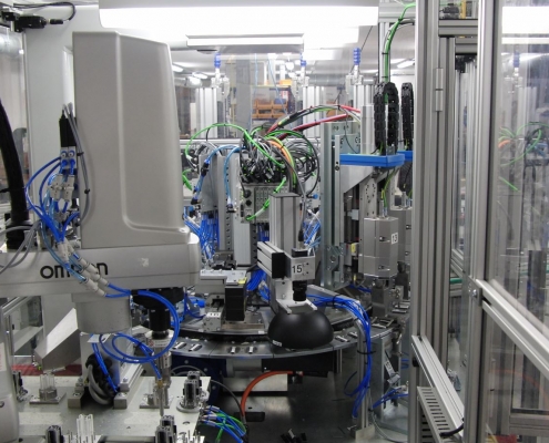 Pick and place product assembly machine with omron robotic arm for product handling